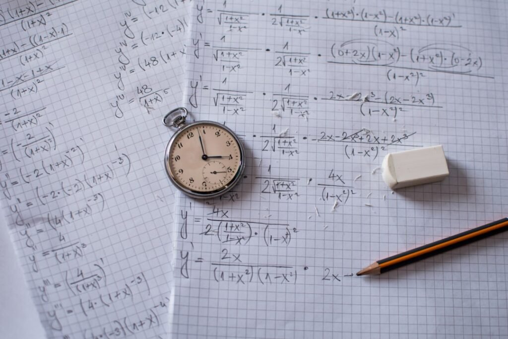 Vintage pocket watch on mathematical calculations and formulas, representing time tracking and learning timeline calculations