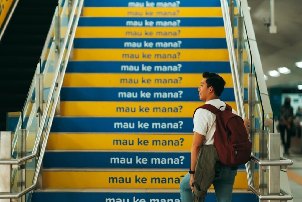 Escalator steps with foreign language text, representing progressive language learning levels and advancement