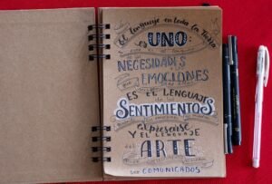 Spanish language learning notebook with handwritten vocabulary words and grammar notes. Photo by Carlos Muza